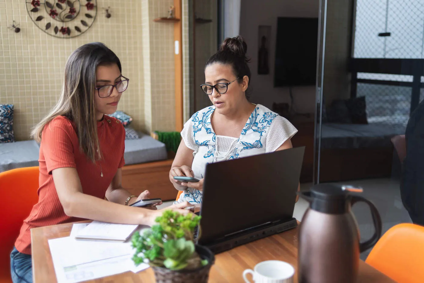 Two women researching retirement bucket strategy.