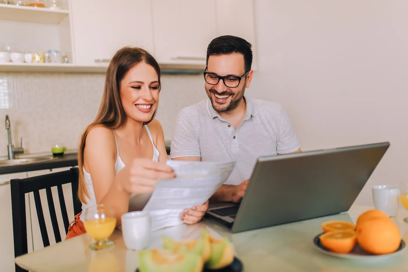 Young couple having fun by saving money