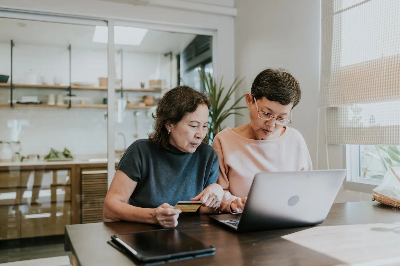 Two women reviewing their 401k statements.