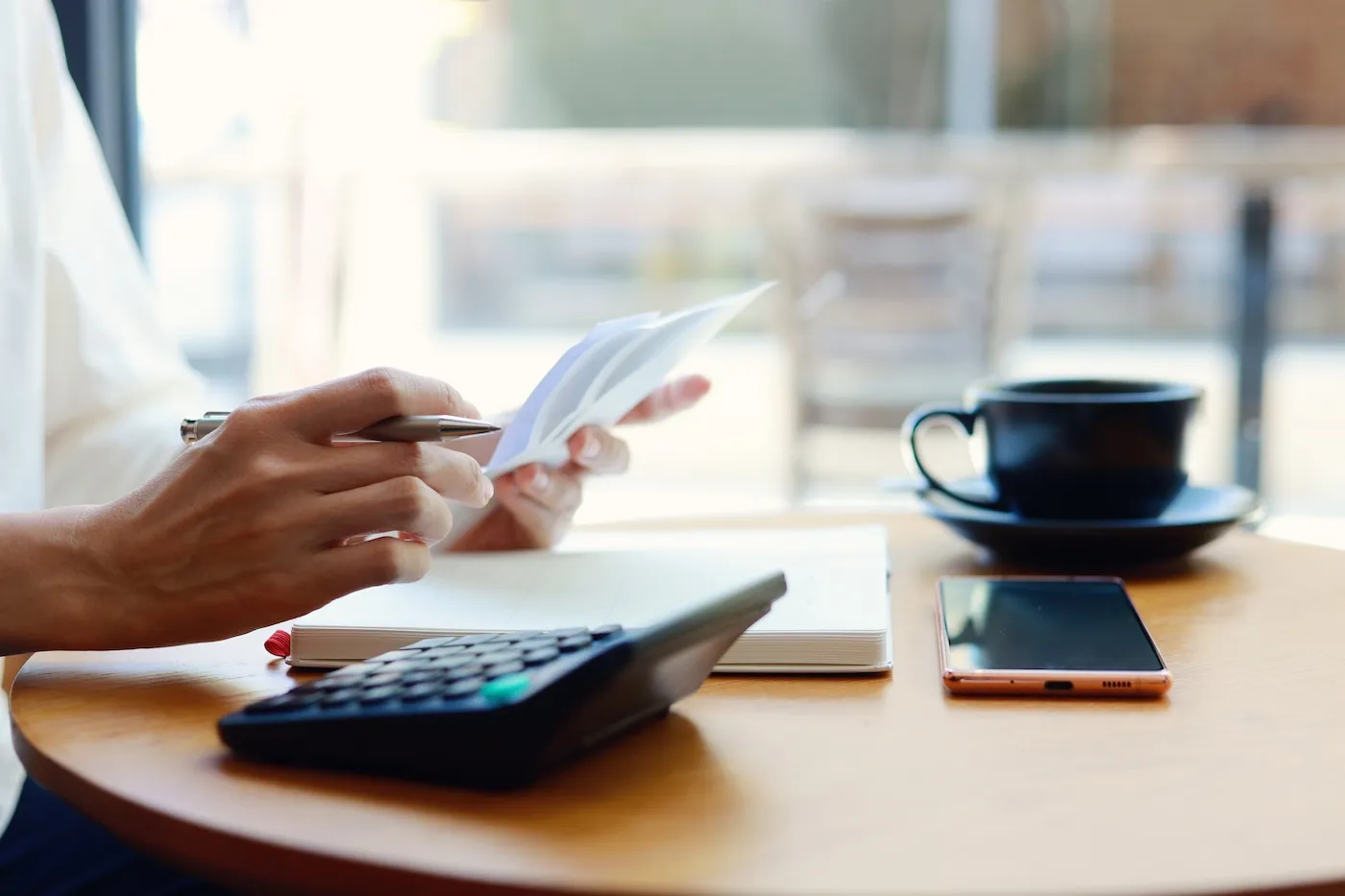 A young woman is seen managing her personal banking and finance.