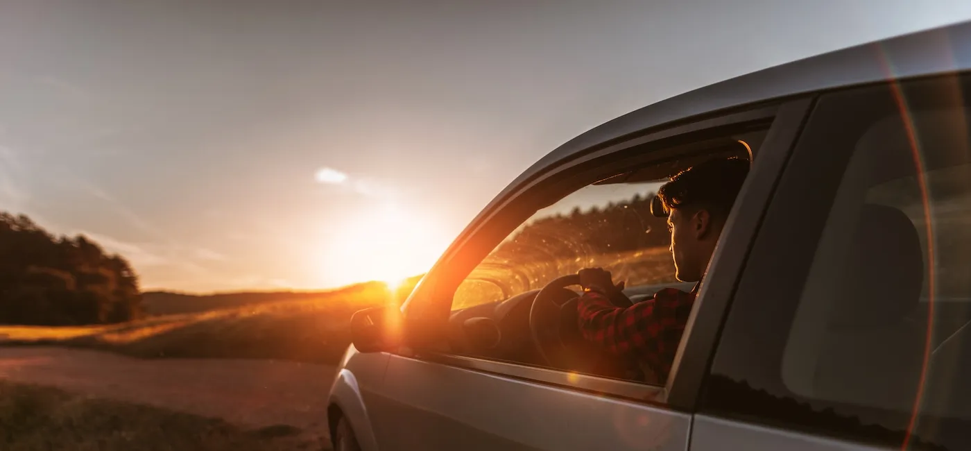 Portrait of young man in car