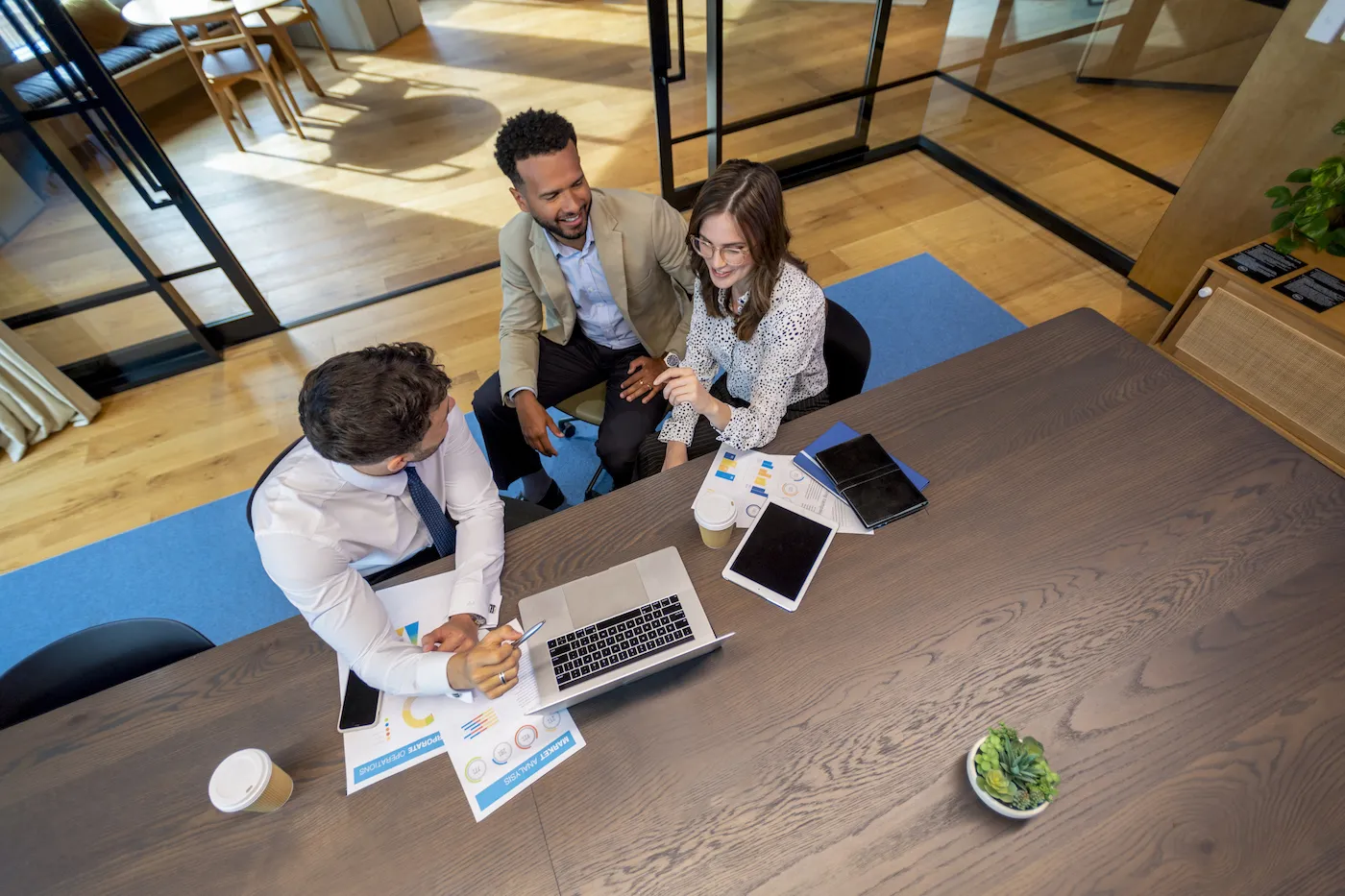 Bank employees taking at a table