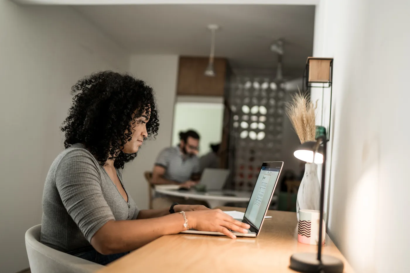 Young woman using laptop at home