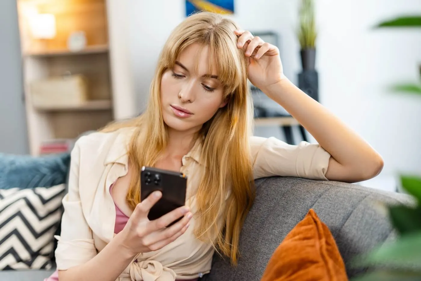 Young woman checking her credit score on the smartphone