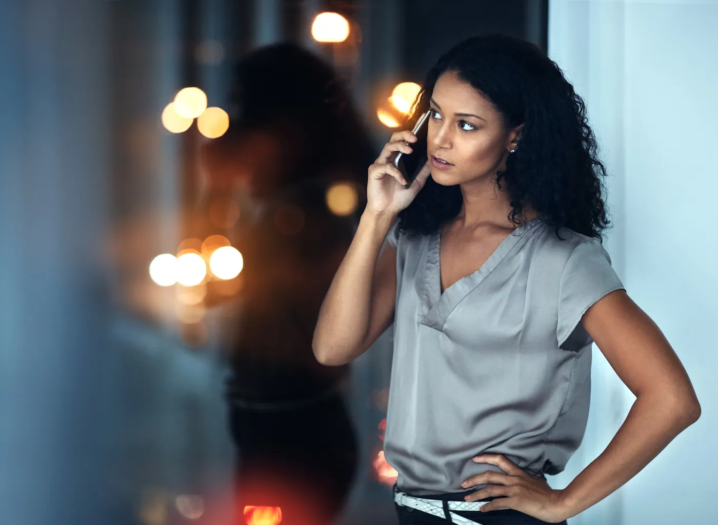 A woman on her cellphone avoiding a debt settlement phone robocall.