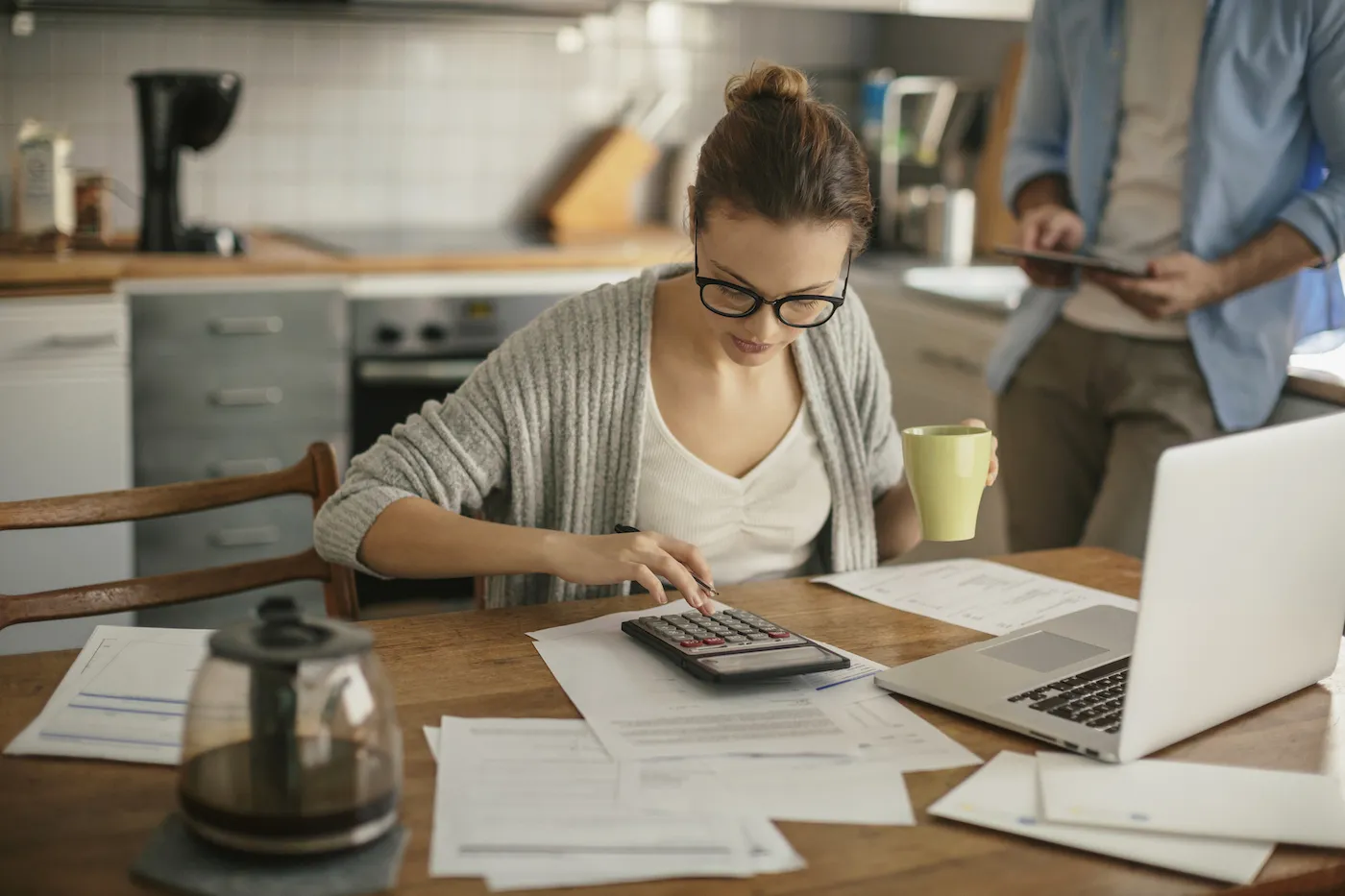 Photo of a young couple calculating home finances heloc