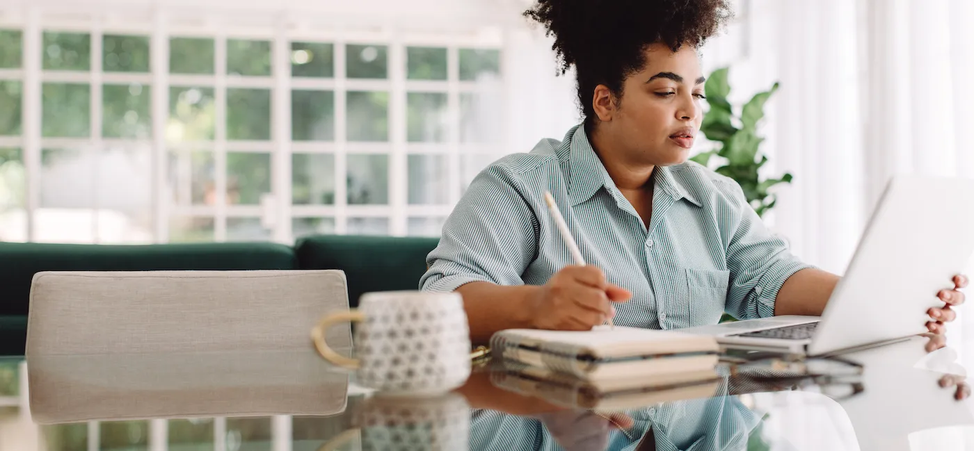 A woman calculating her quarterly self-employment taxes.