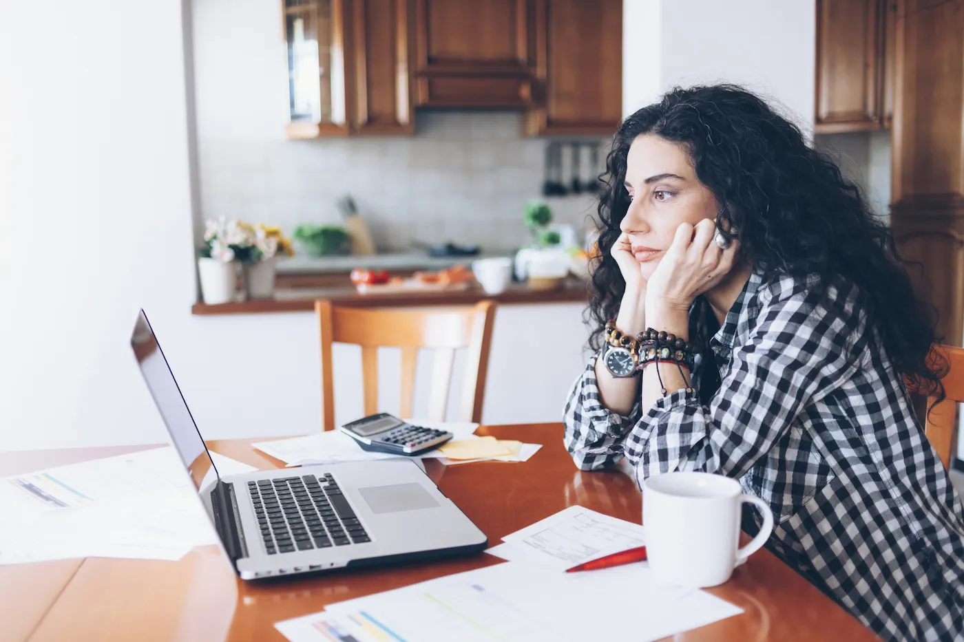 Woman contemplating debt