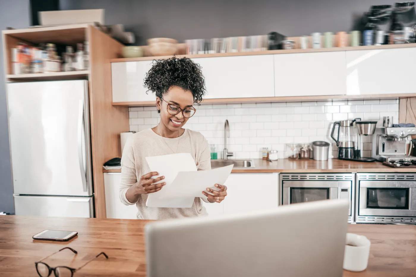 Woman looking through her savings statements.