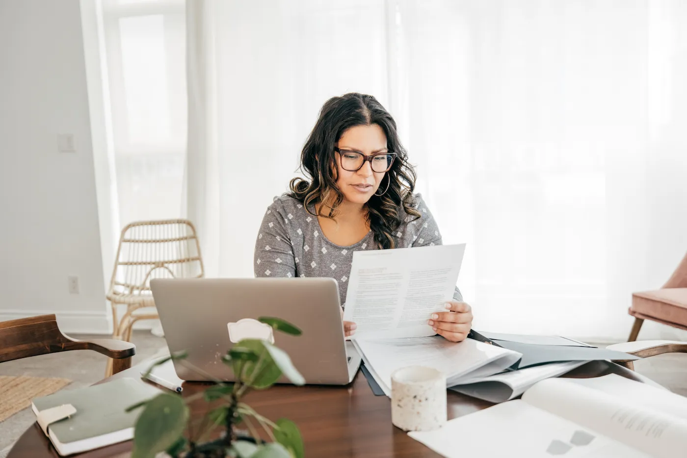 A woman doing her taxes and avoiding a W2 scam