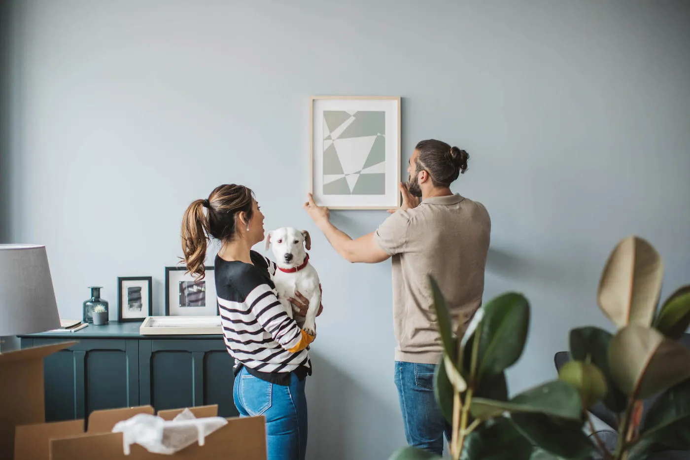 Young couple moving in new house.