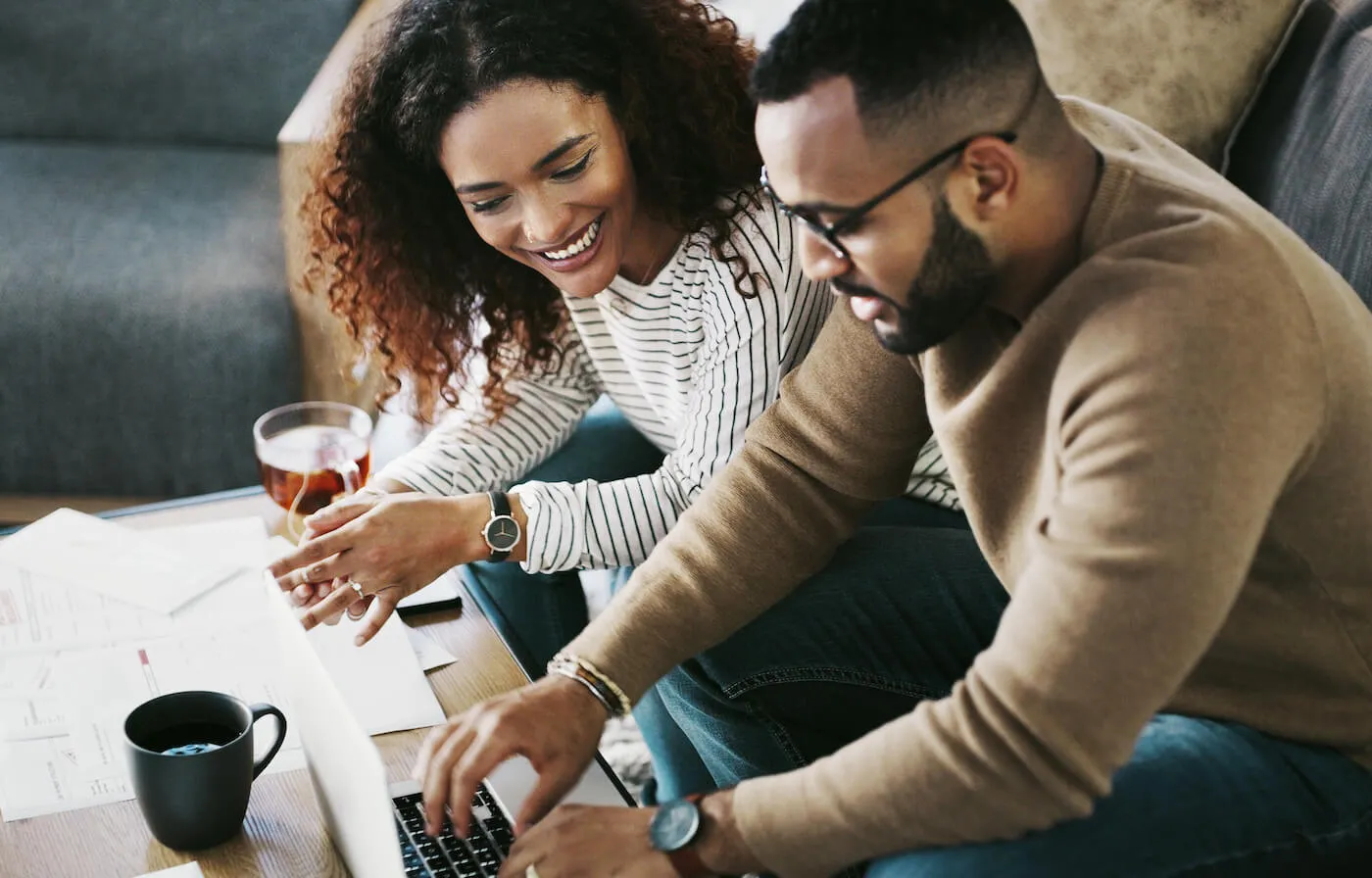 Young man and woman married couple dividing expenses.