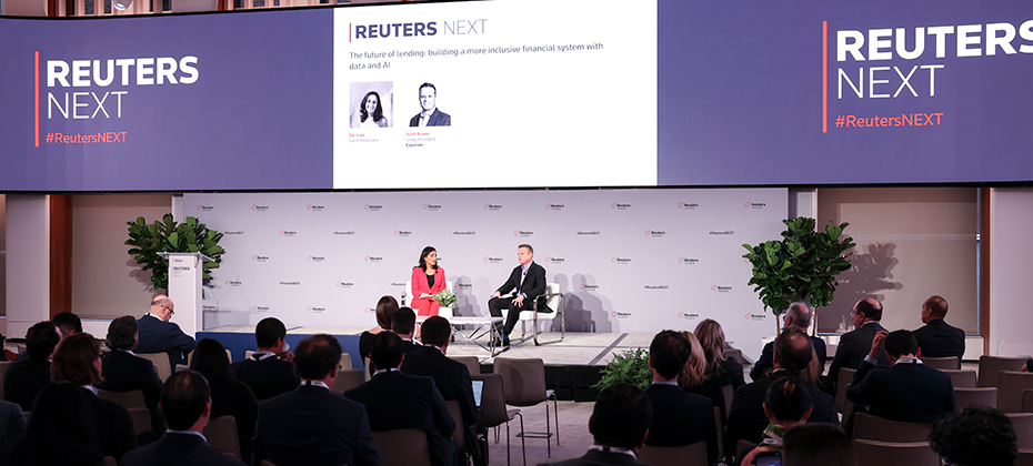 Scott Brown and Del Irani having a discussion onstage at Reuters Next