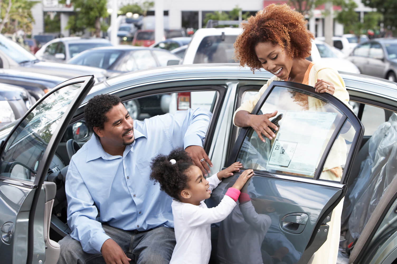 family getting into a car