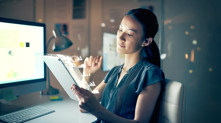 woman working on tablet and computer