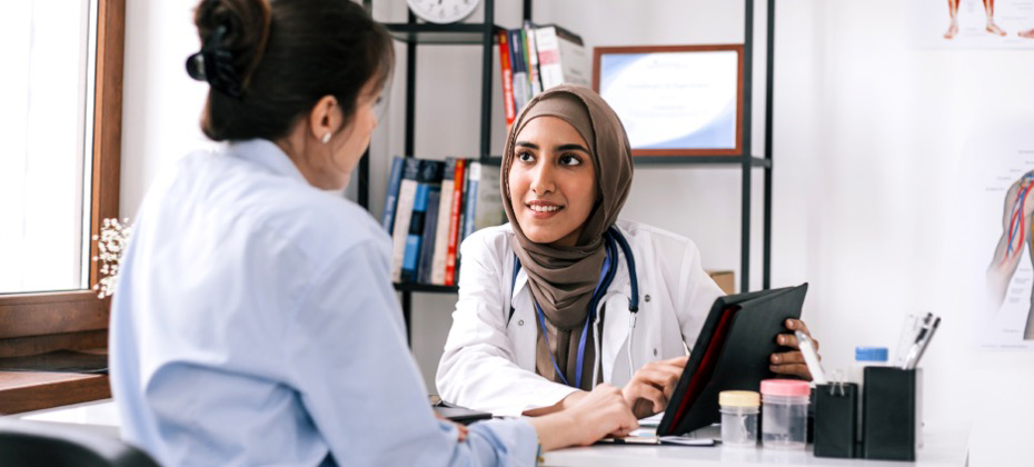 doctor talking to patient in office