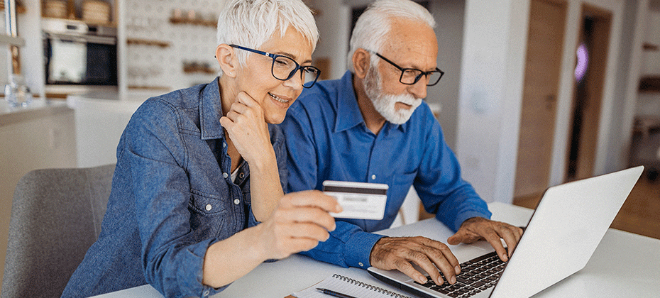 patients paying a bill on a computer