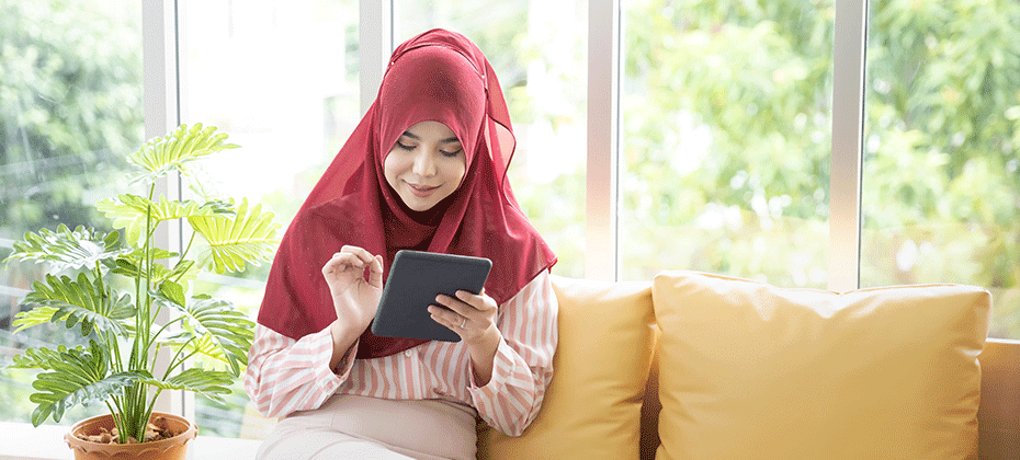 woman looking at tablet