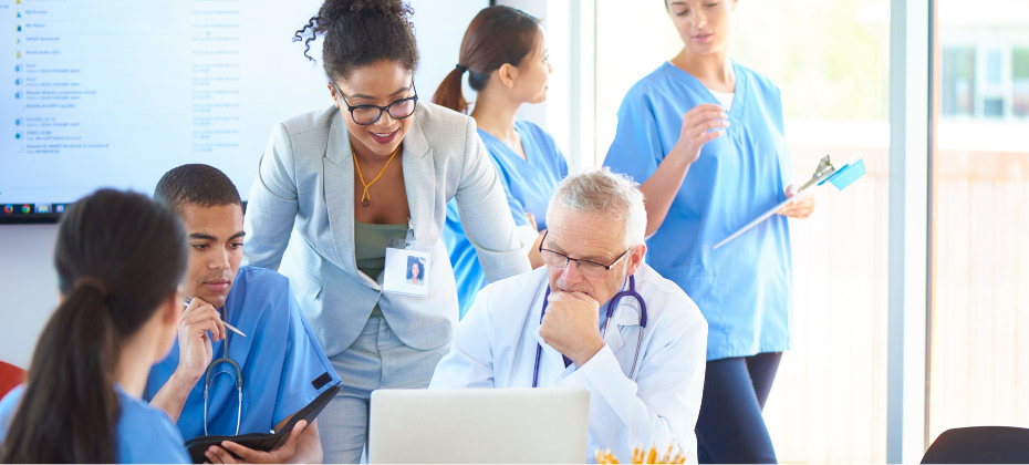 group of providers looking at a computer